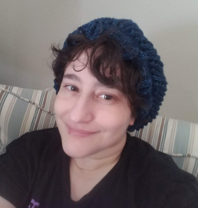 Me sporting a hat I knitted.